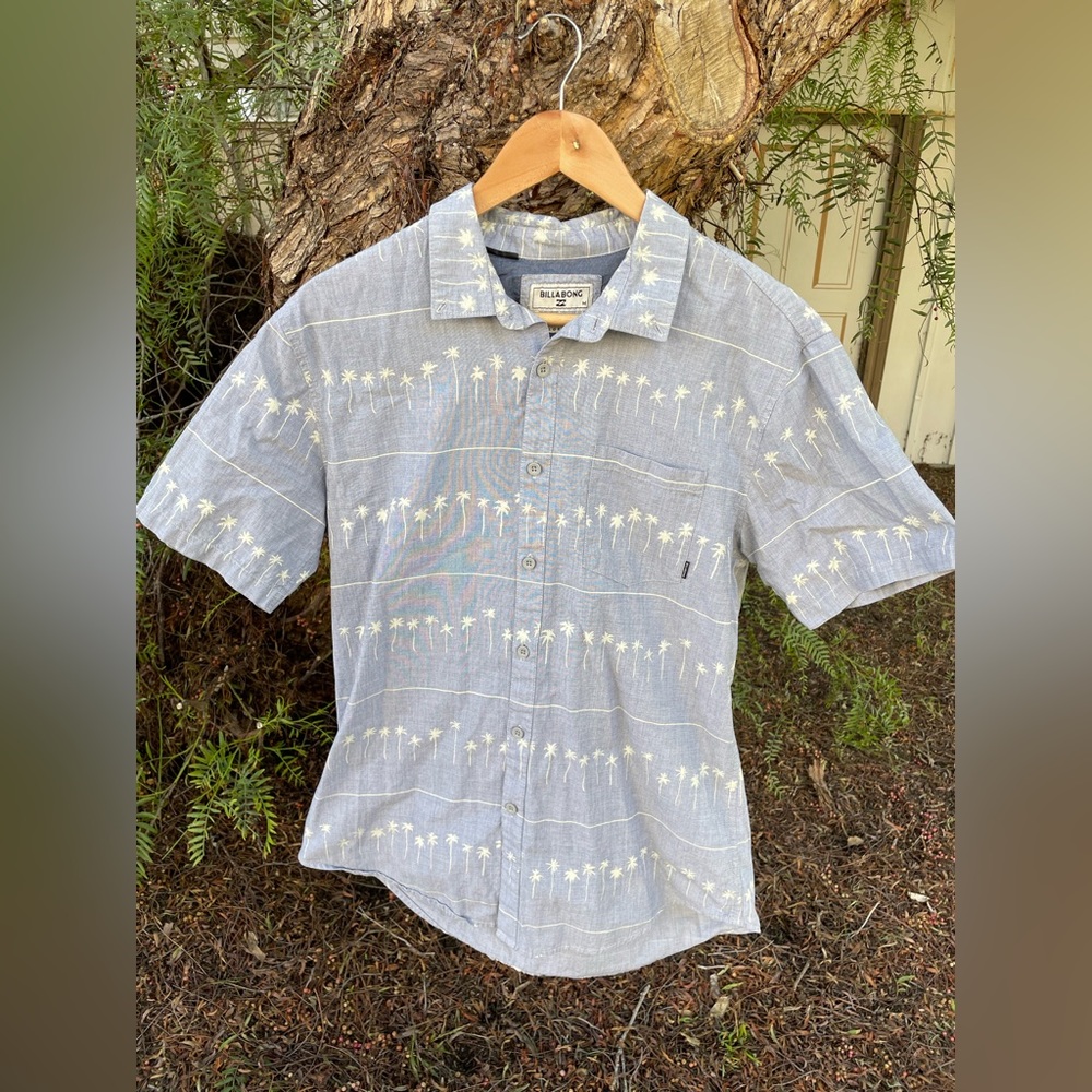 Light blue Billabong short sleeve button up short.